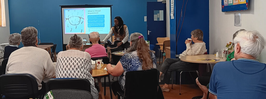 CRCB's Outreach Officer, talking to a group of people about sight loss