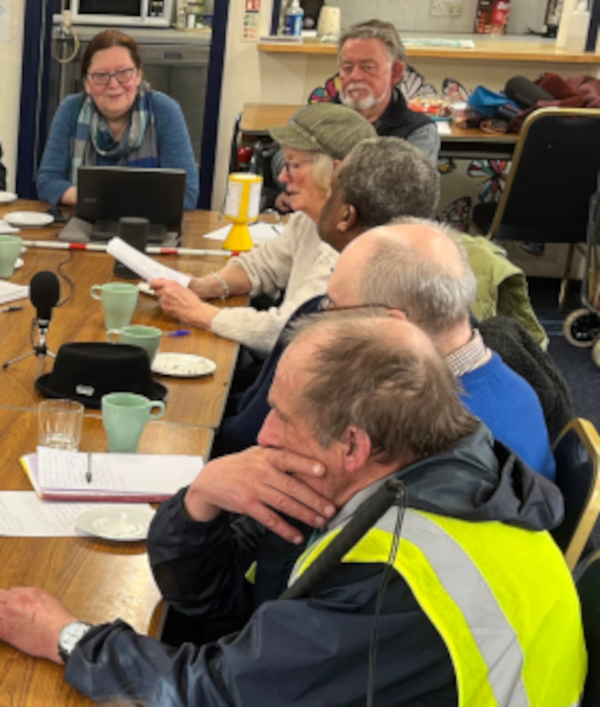 Members of the Creative Reading Group listening to an actor reading